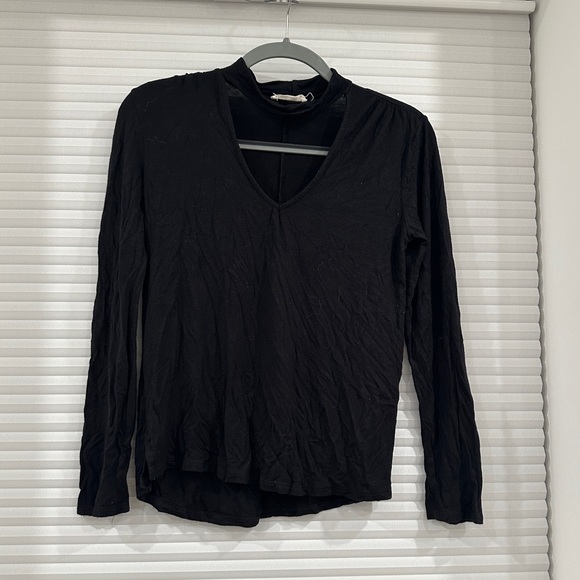 Tops - Black long sleeve blouse with cutout.